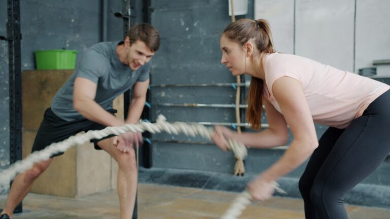 A person in their 50s doing strength training for longevity in a well-lit gym
