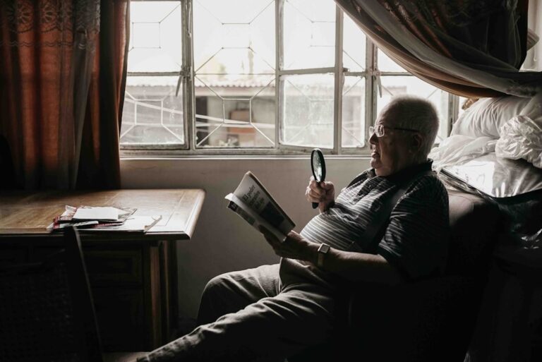 A healthy adult over 40 reading and staying mentally sharp, representing brain aging after 40 and cognitive longevity