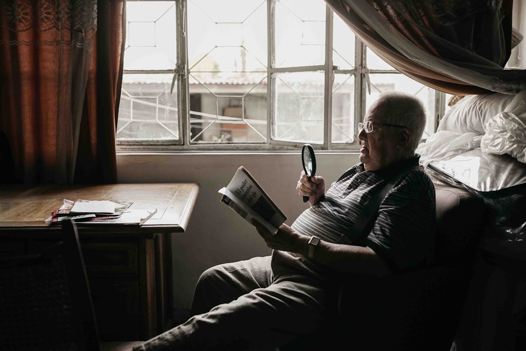 A healthy adult over 40 reading and staying mentally sharp, representing brain aging after 40 and cognitive longevity
