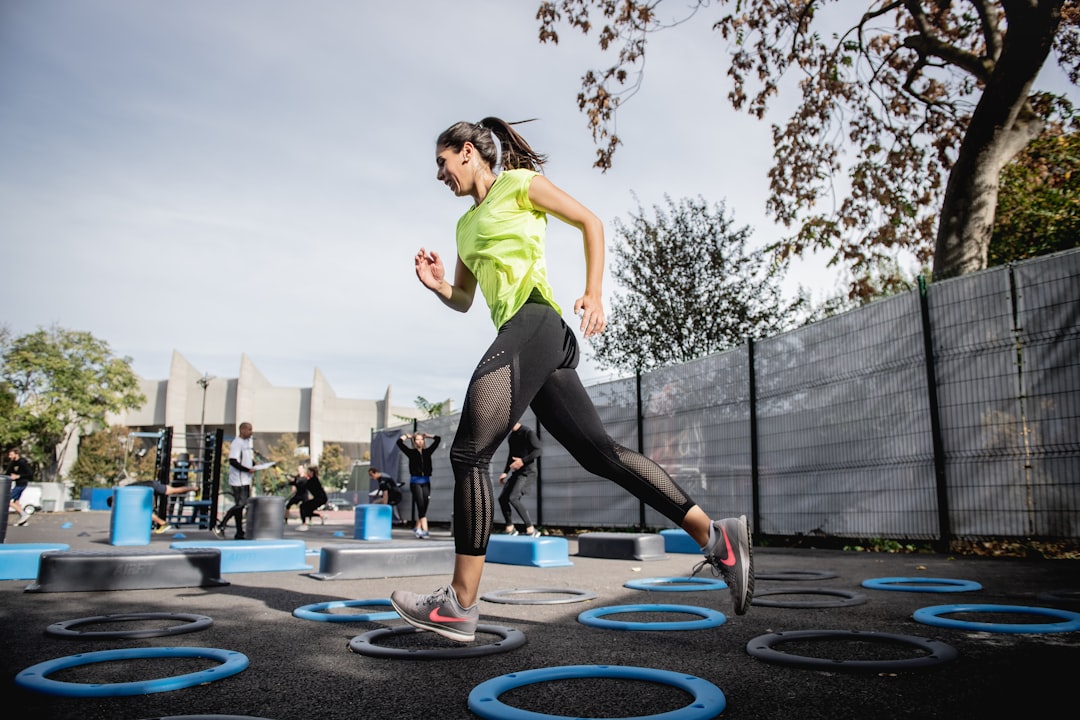 Person running outdoors to improve cardiovascular fitness for longevity
