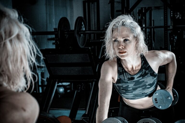 A woman over 50 doing strength training in a gym, illustrating the benefits of creatine for women over 50