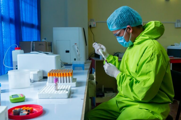 A doctor reviewing longevity biomarkers to track on a digital health dashboard, including blood panels and fitness metrics