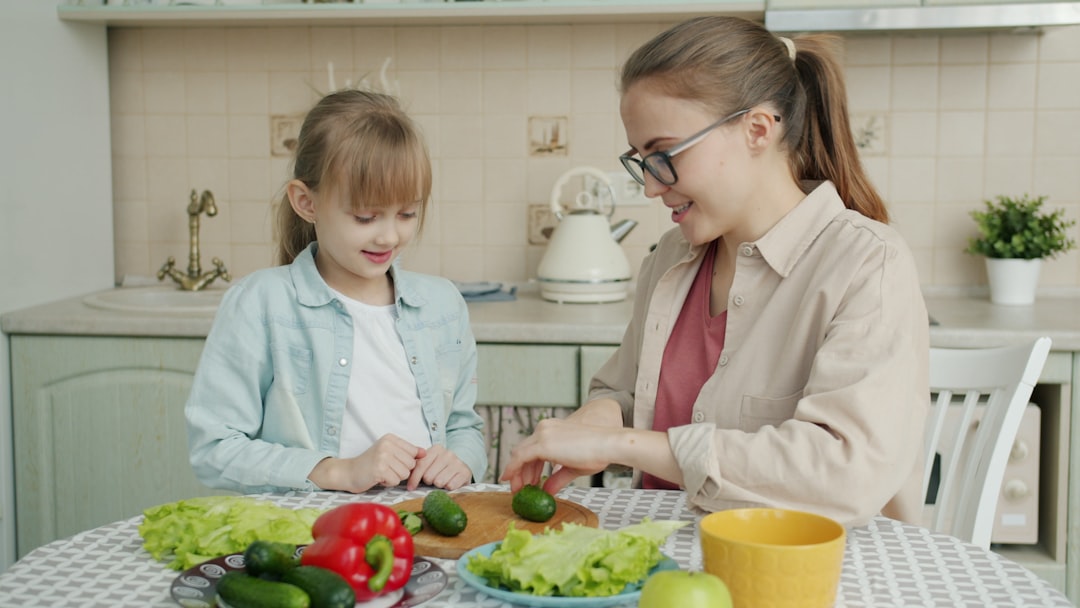 A person over 60 preparing a protein-rich meal at home, illustrating protein timing after 60 for muscle health and longevity
