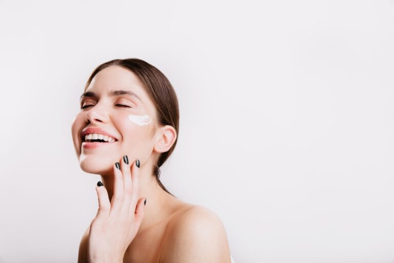 Woman with healthy glowing skin demonstrating evidence-based skin aging science and anti-aging skincare