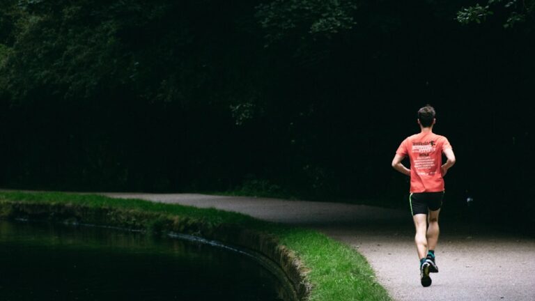 Man running on a trail to improve VO2 max by age — a key longevity metric