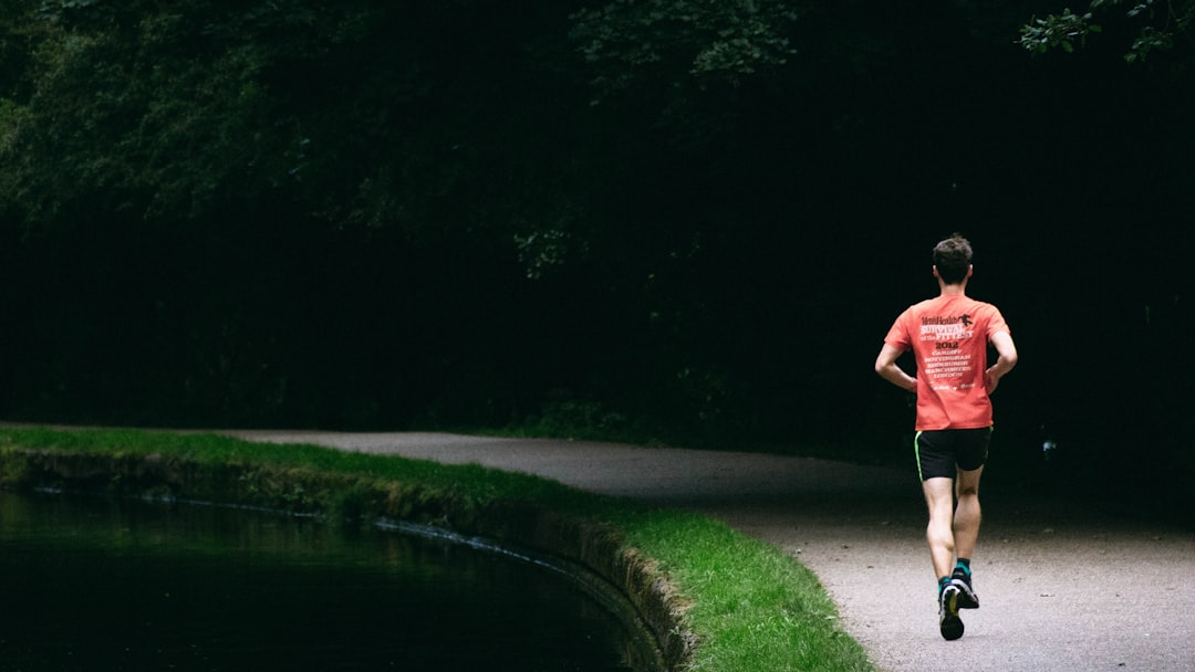 Man running on a trail to improve VO2 max by age — a key longevity metric