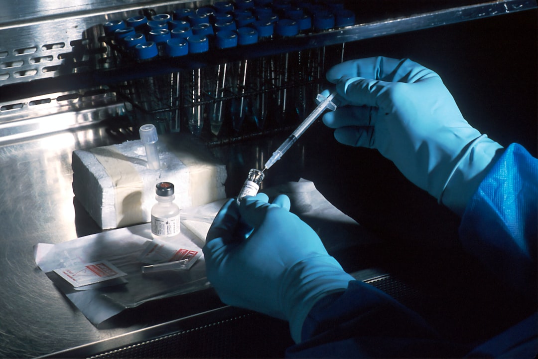 A lab technician preparing a blood test tube for IGF-1 insulin-like growth factor 1 aging analysis