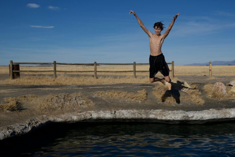 Athlete preparing for cold water immersion after a strength training session — cold plunge after lifting may blunt muscle gains