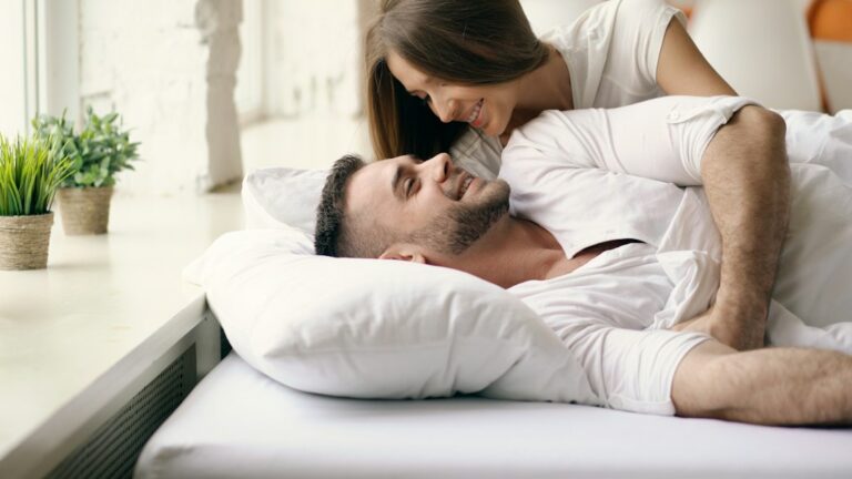 Man sleeping deeply in a dark bedroom, illustrating the connection between creatine and sleep quality