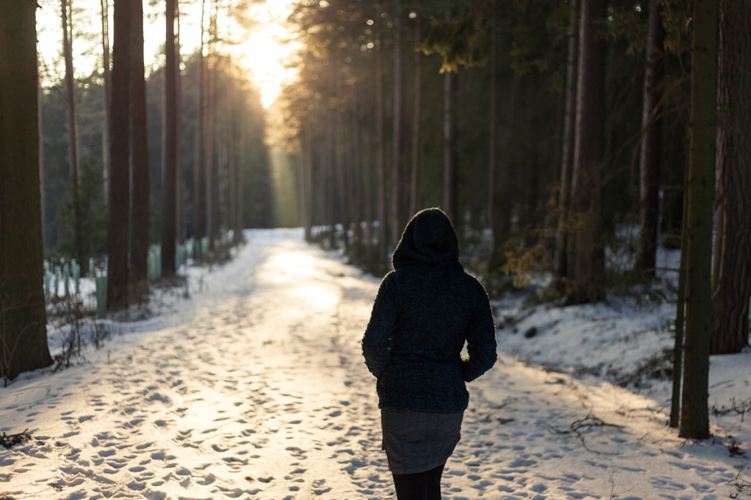 Woman running outdoors in the morning — exercise timing and longevity research