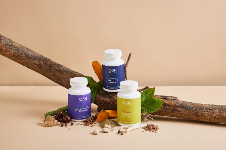 Spermidine vs GlyNAC supplements for longevity laid out on a wooden table with natural light
