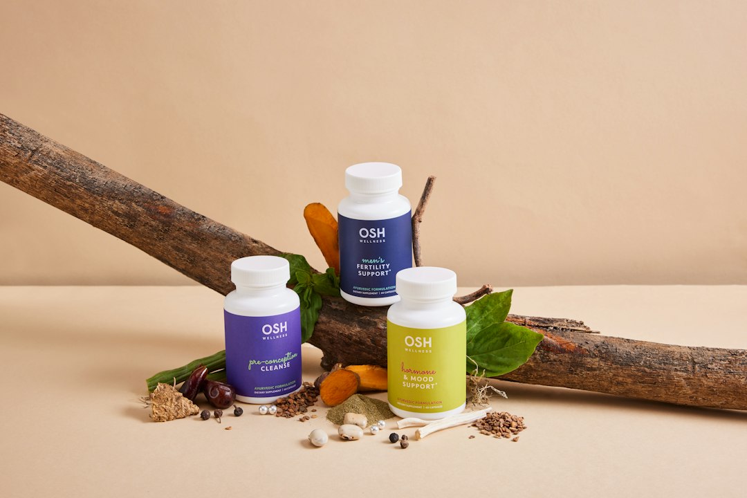 Spermidine vs GlyNAC supplements for longevity laid out on a wooden table with natural light