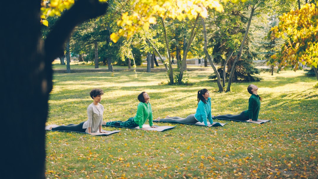 Active woman stretching her knee outdoors, representing collagen supplements for joint health and mobility