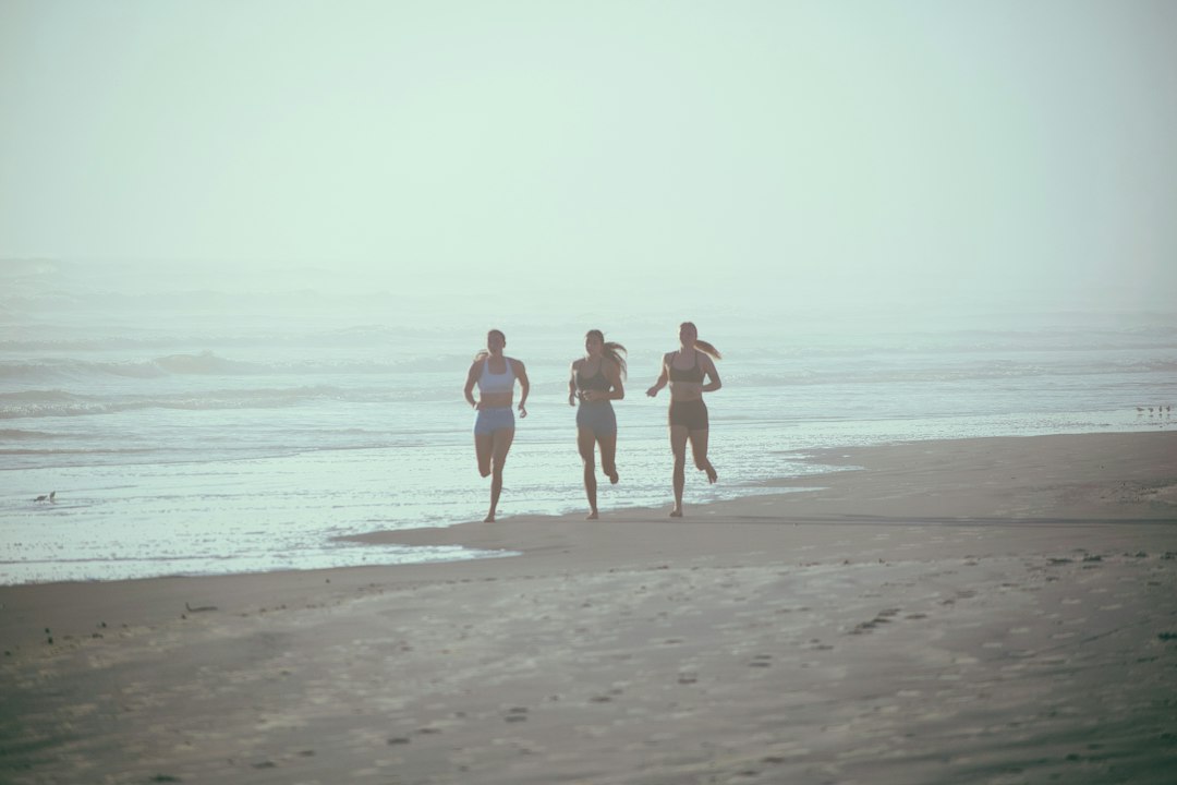 A healthy woman in her 50s running outdoors — representing resistance to menopause accelerated aging through exercise